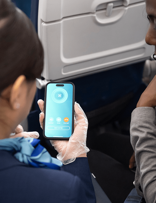 Flight attendant using the MedAire in-flight app