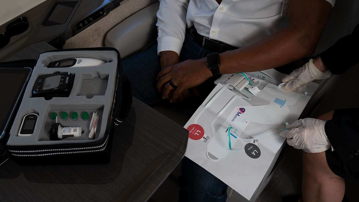 MedAire Digital Assessment Kit (DAK) being used by a flight attendant to assist a person experiencing an in-flight medical event