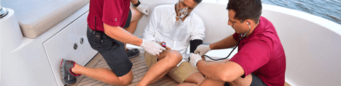 Crewmember learns first aid from a MedAire medical instructor