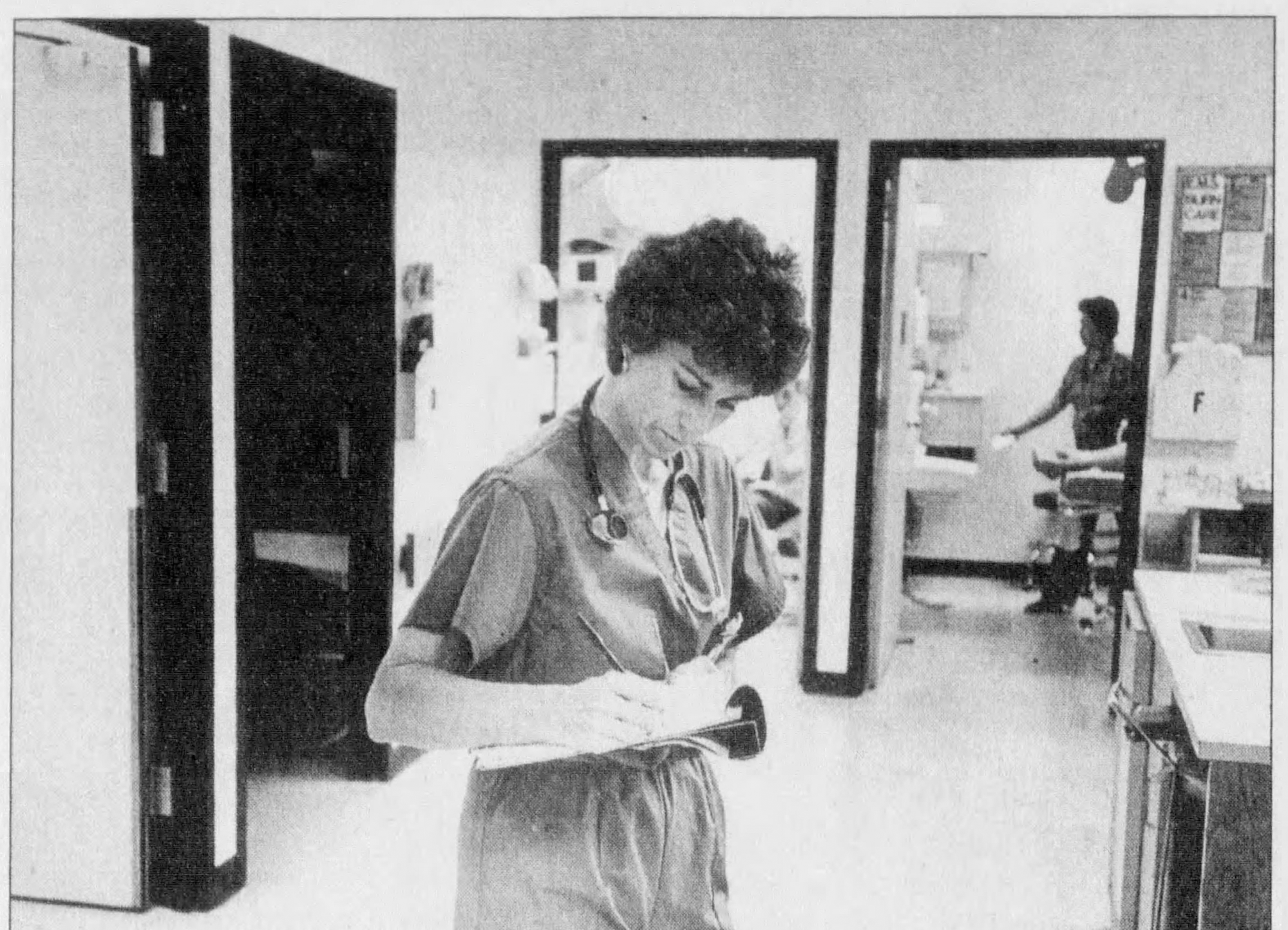 Joan Sullivan Garrett working as an emergency-room nurse in Arizona