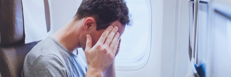 Cabin crew assessing a passenger in-flight